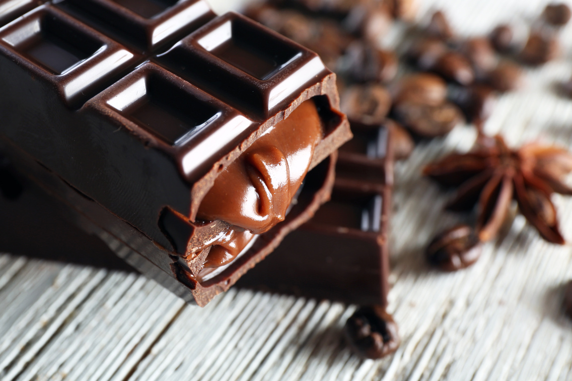 Stuffed Chocolate with Coffee Beans on Wooden Table